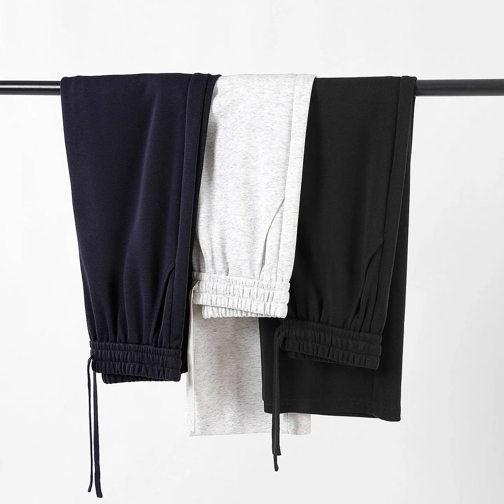 High-waisted straight-leg cotton trousers in loose fit, shown in available colours, sizes M to 3XL