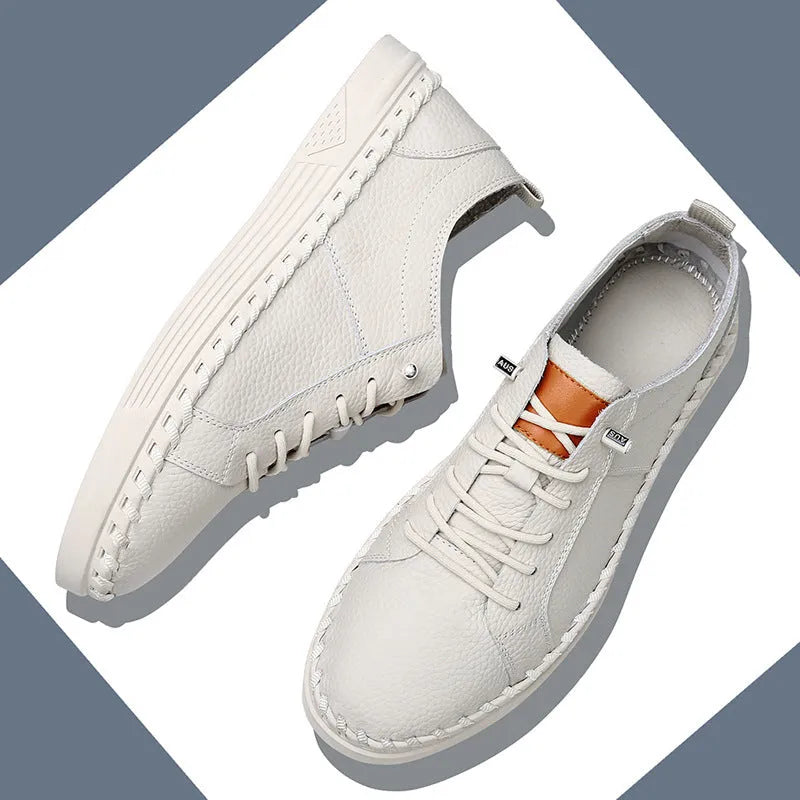 Beige and black men's round-toe cowhide sneakers with mesh lining and stitching detail.