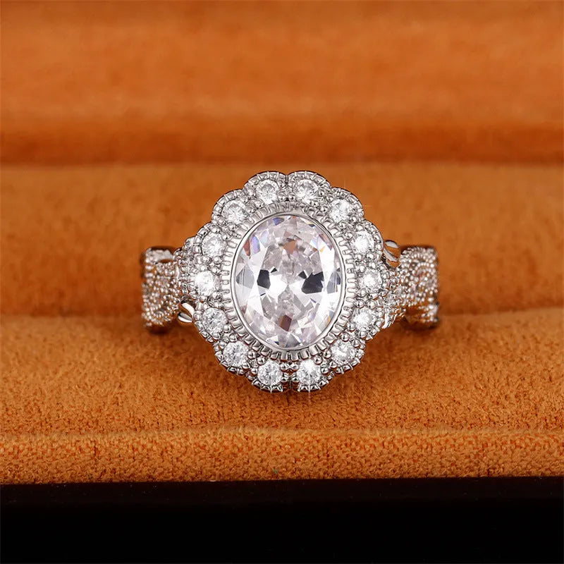 Round zircon ring with diamond copper plating in white gold colour on finger
