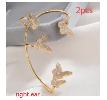 Sparkling zircon butterfly ear cuffs in gold-toned metal, featuring a delicate and elegant design for stylish accessorizing