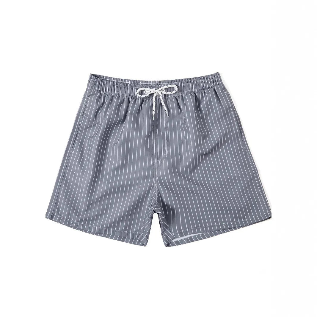 Men's polyester beach shorts with striped triangle pattern in navy blue colour showing straight leg opening