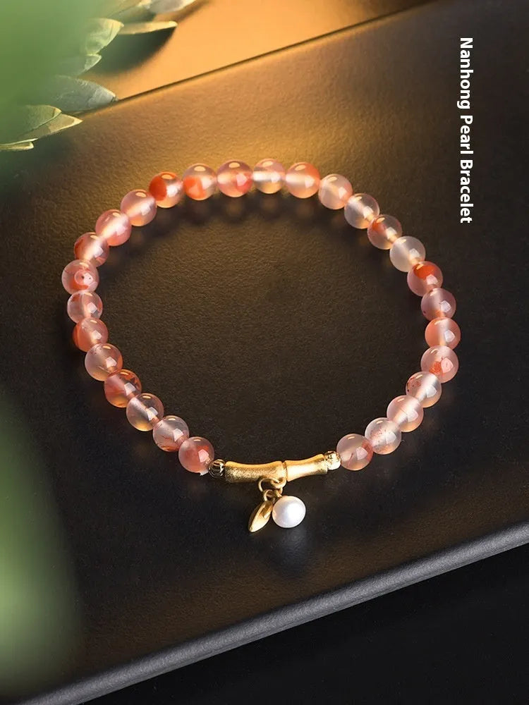 Ice Float Nanhong Agate Bracelet with flower shape and bamboo joint design.