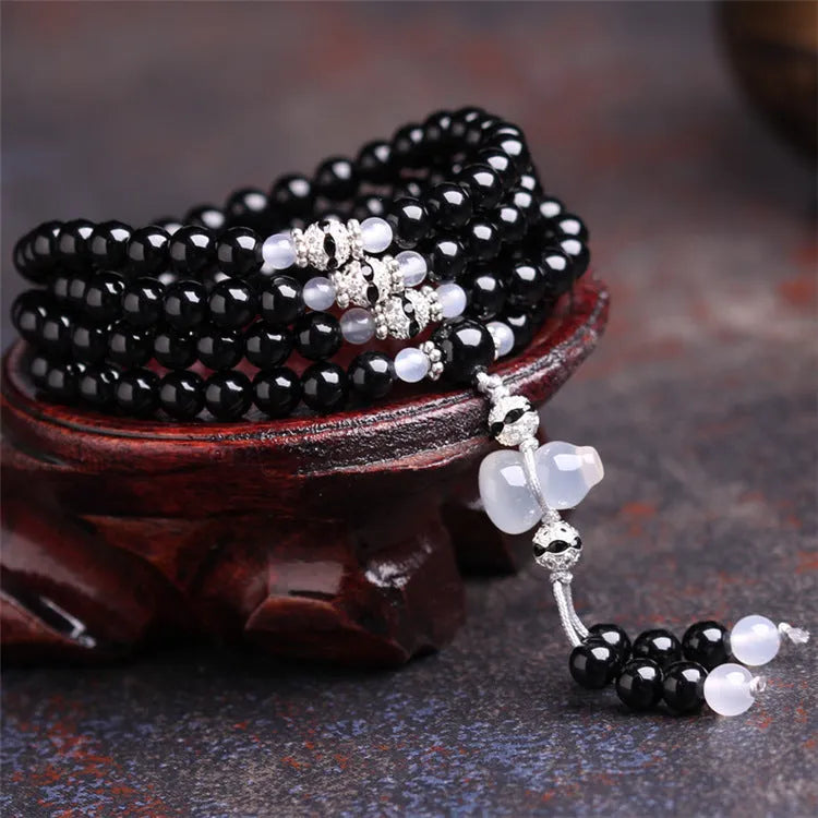 Black agate 108 beads bracelet with geometric shapes and numeric markers on unisex wrist