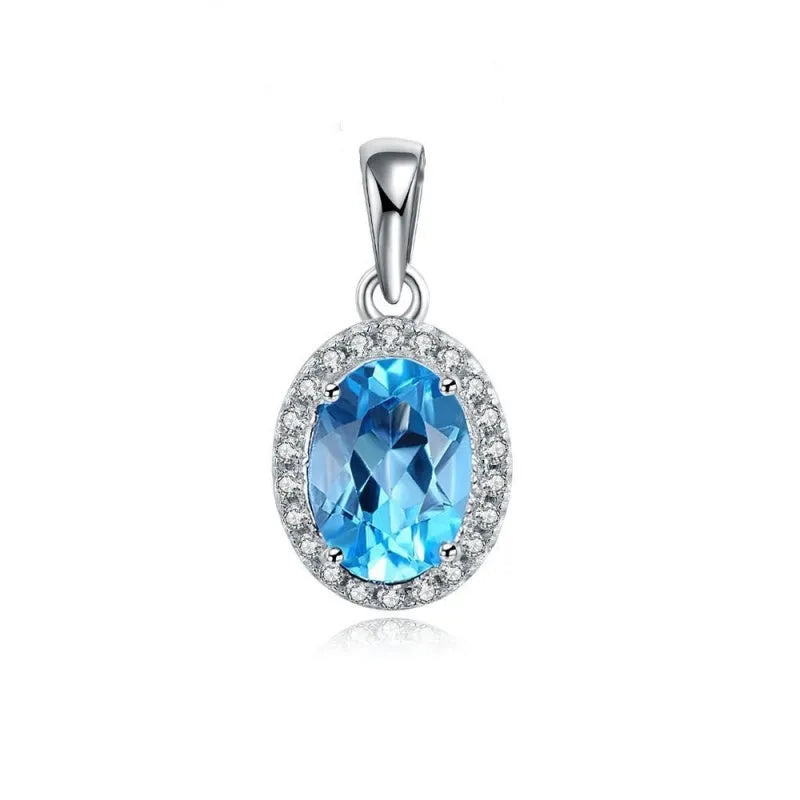 Geometric sterling silver jewellery set with blue topaz gems including earrings, ring, pendant and necklace