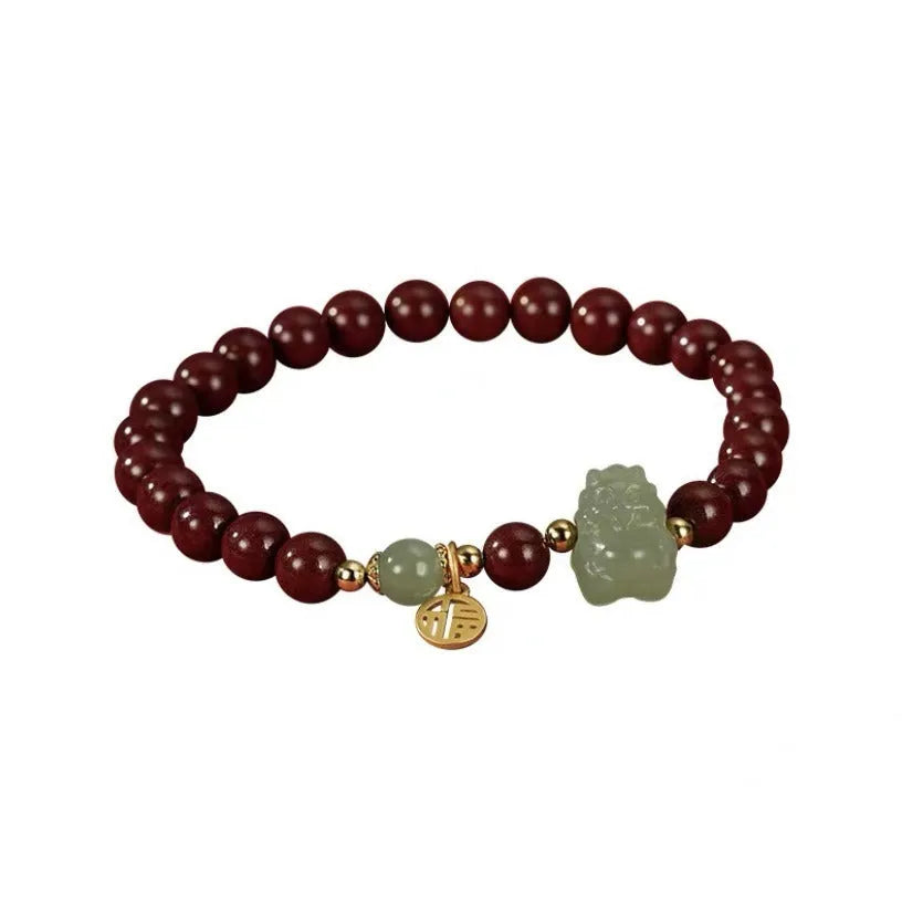Natural Hetian Jade bracelet in 8mm diameter with animal zodiac motif.