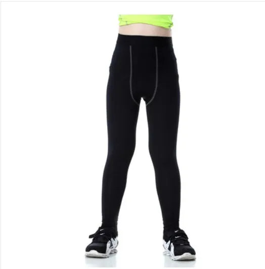 Kids sportswear set showing T-shirts, shorts and trousers in black and green with Asian sizing chart