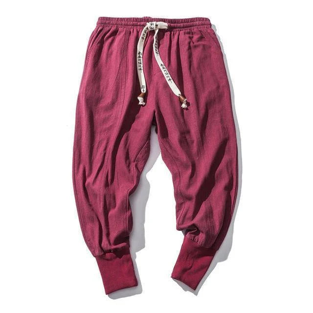 Comfortable linen and cotton harem pants for men, featuring an elastic waistband and a relaxed, trendy silhouette