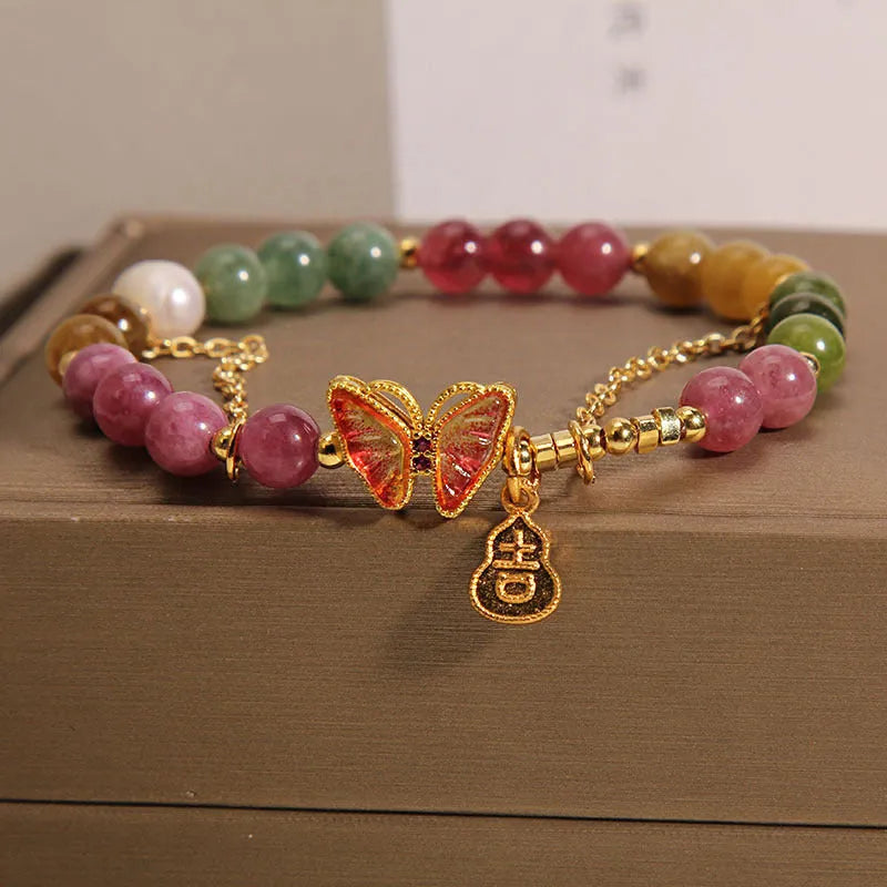 Natural jade coloured agate bracelet for women with butterfly and gourd shaped beads.