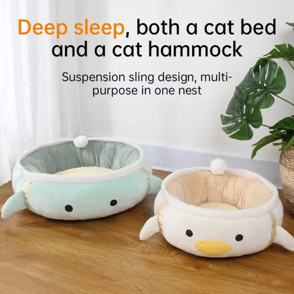 Green chick and dinosaur shaped plush cat bed shown both lying flat and hanging as a hammock.