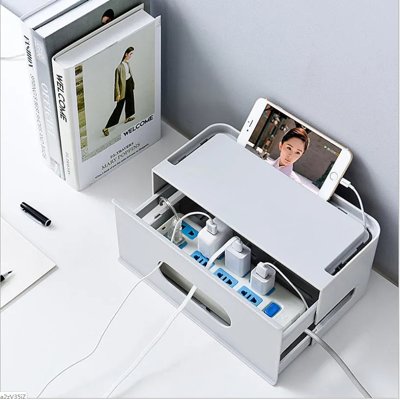 Grey and white plastic router storage box with cable ports for home cable management