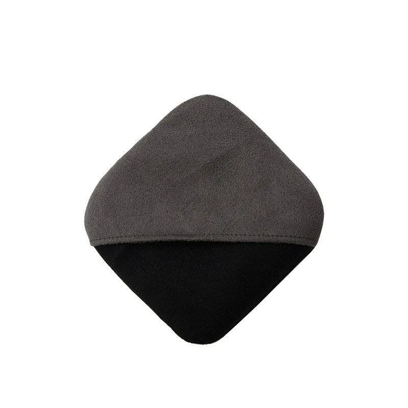 Grey keyboard dust cloth placed over a laptop keyboard for dust protection