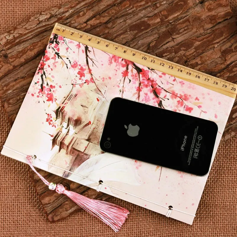 Azalea-coloured Chinese style notebook with thread binding showing watercolour retro cover