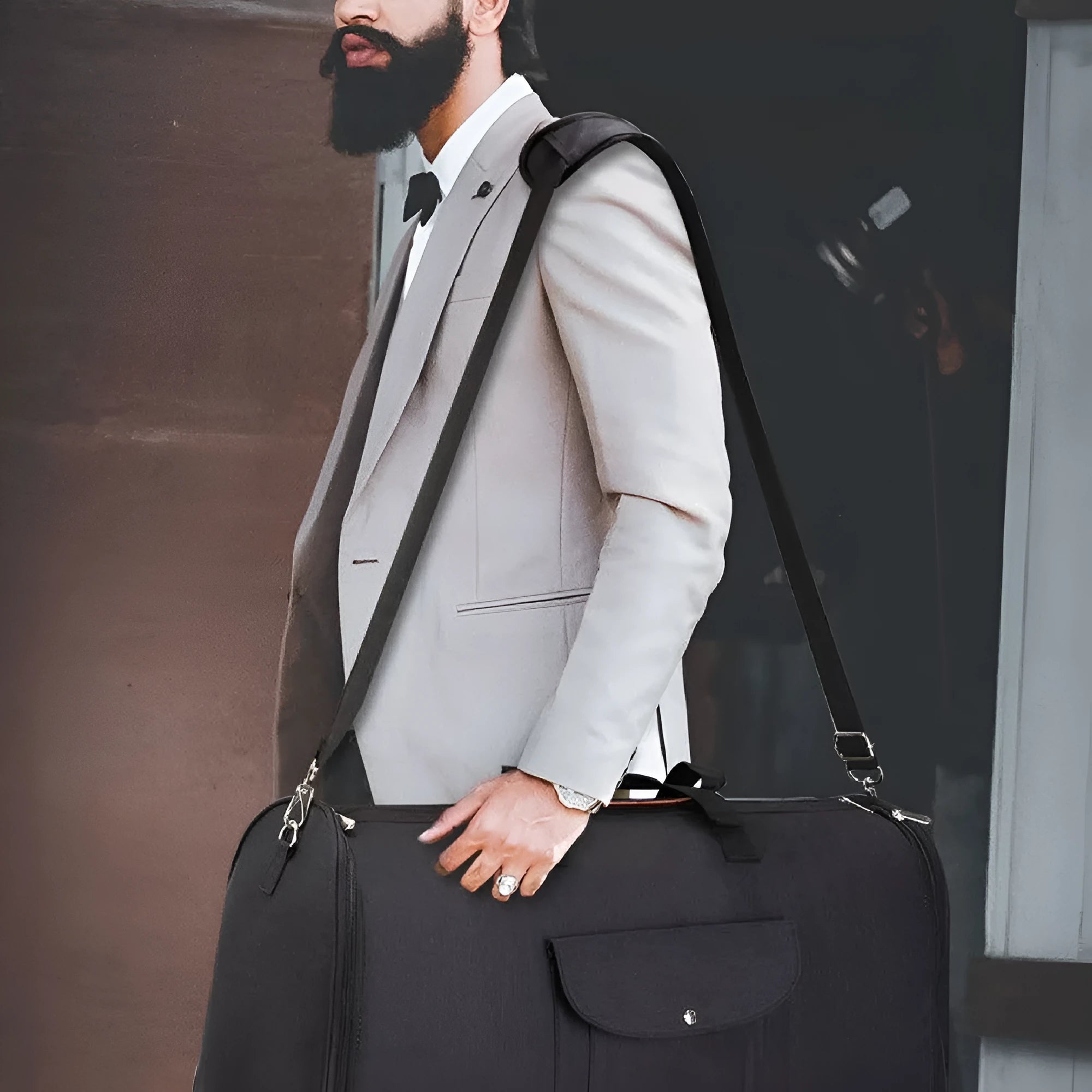 Dark blue folding duffel bag made from Oxford cloth with carry handles, showing its size and style.