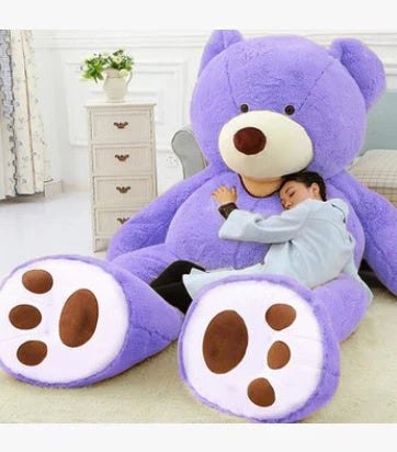 A plush, giant teddy bear with realistic facial features and a soft, huggable design