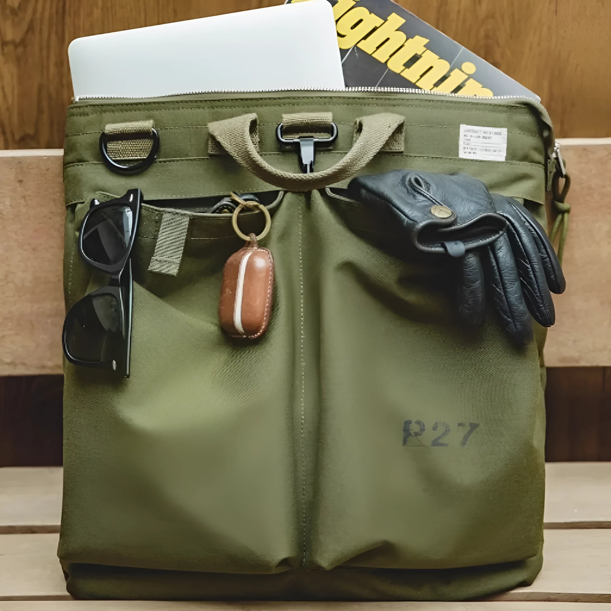 Canvas crossbody messenger bag in retro style showing military green colour with shoulder strap
