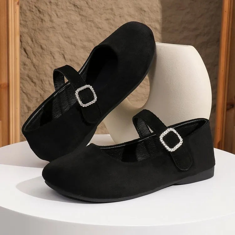 Men's solid black flat fisherman shoes with canvas upper and rubber sole on a white background.