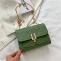 Women's crossbody bag with diamond lattice chain strap in black PU leather showing front view