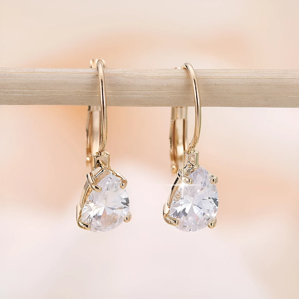 Women's drop-shaped fashion earrings in gold or platinum finish with copper construction