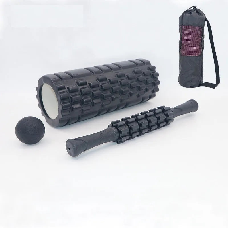 33cm black fitness foam roller massage stick on a plain background.