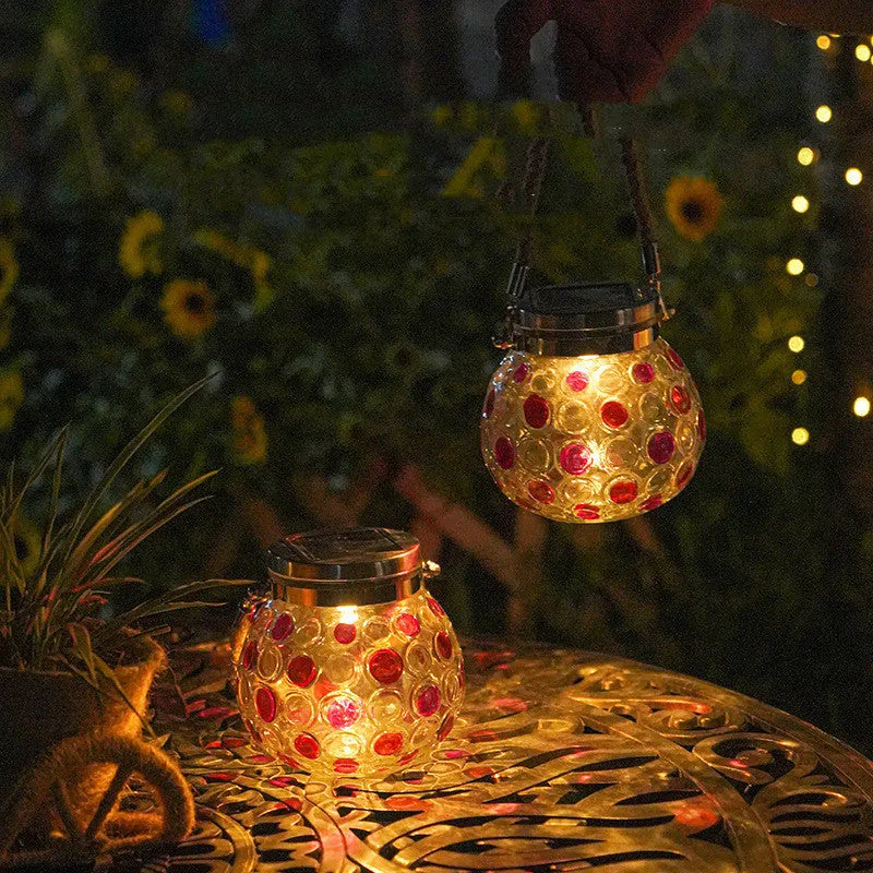 Solar decorative wave point outdoor night light IP65 waterproof in blue colour on a garden table