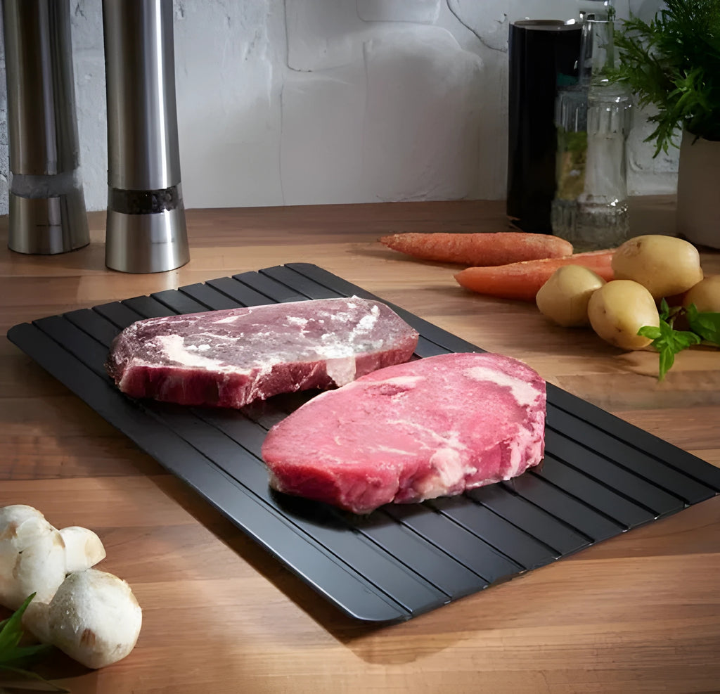 Black aluminium fast defrosting tray for kitchen use on a countertop
