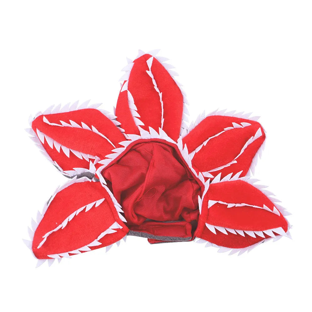Dog wearing Halloween demon chomper costume with scary headband and fabric flower decoration