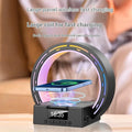 White multifunctional Bluetooth speaker with wireless charging pad, bedside lamp and digital clock display on wooden table