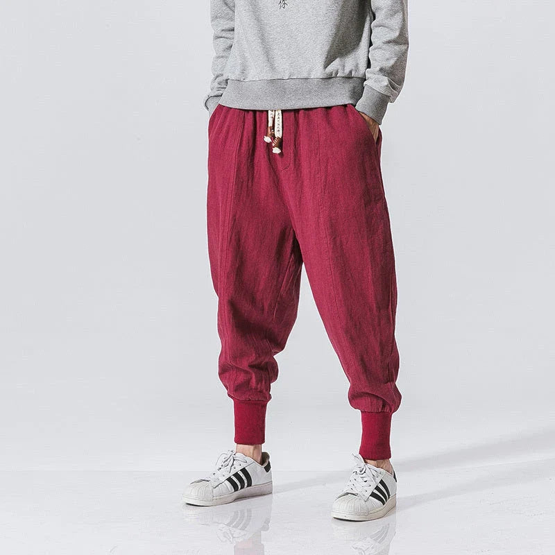 Comfortable linen and cotton harem pants for men, featuring an elastic waistband and a relaxed, trendy silhouette