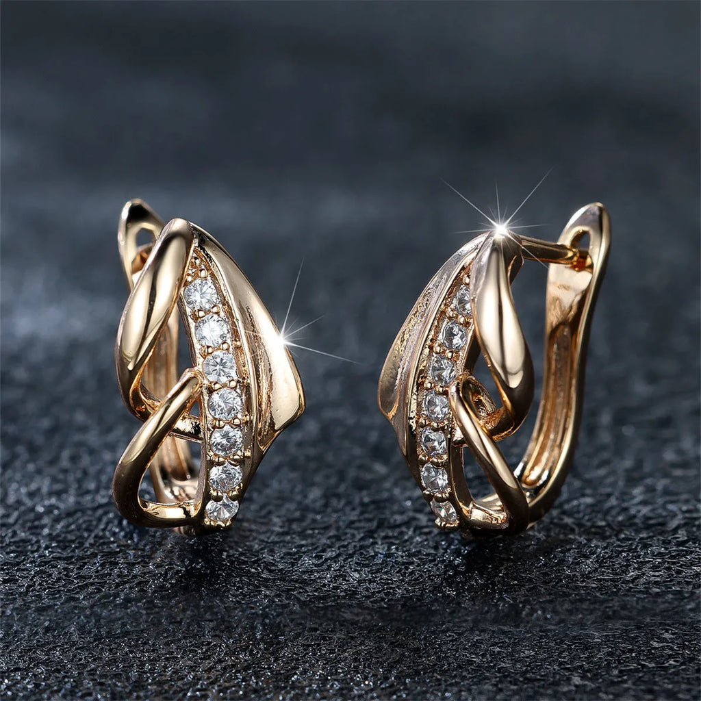 Champagne gold copper ear clip with white diamond centre, geometric arrow shape