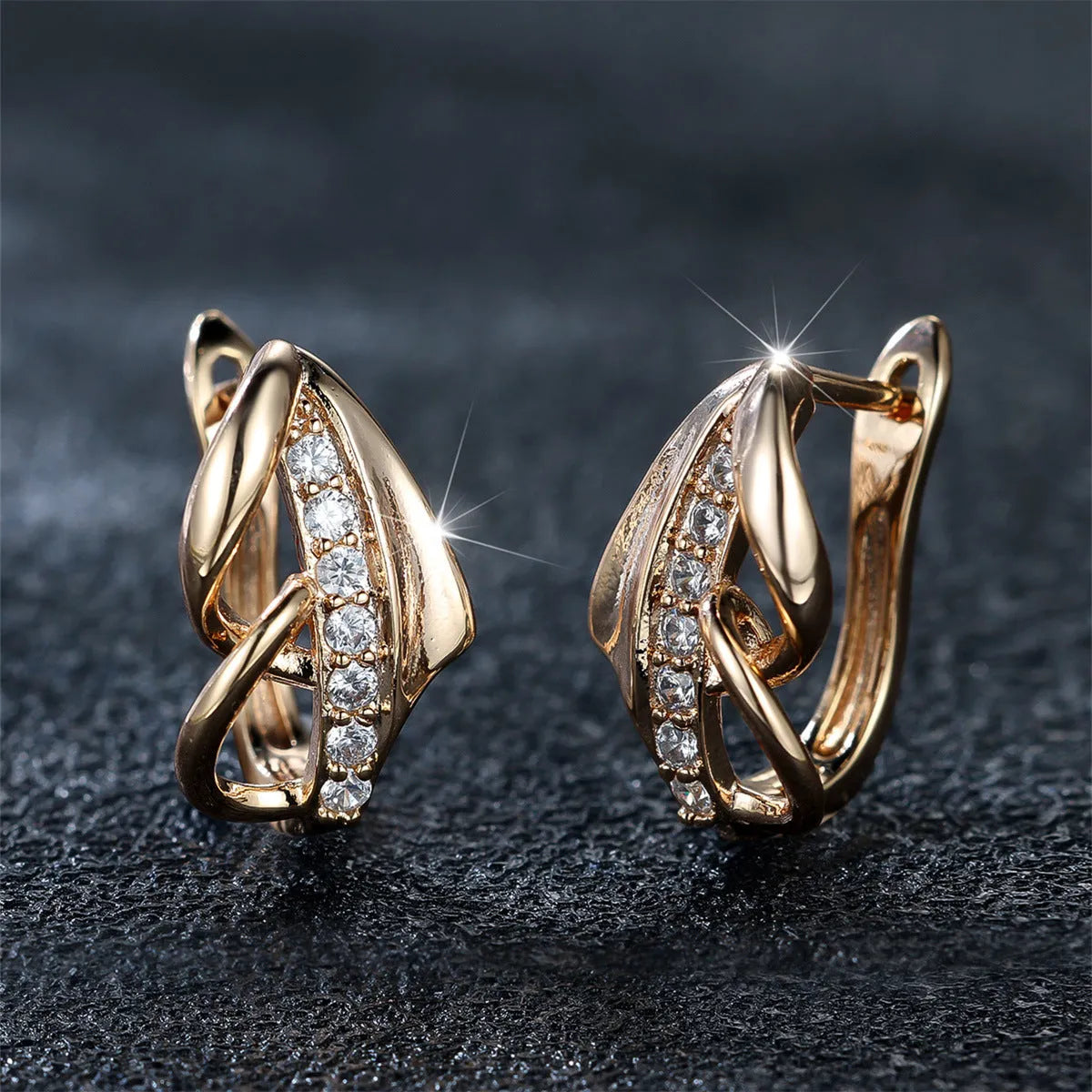 Champagne gold copper ear clip with white diamond centre, geometric arrow shape