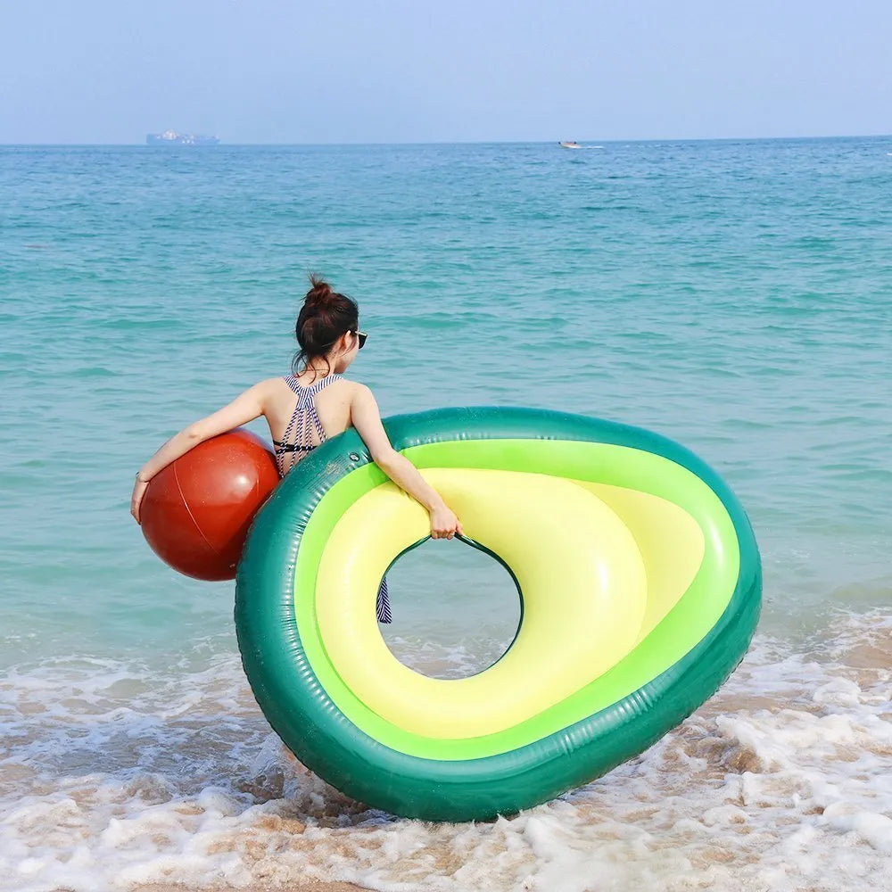 Green avocado-shaped inflatable pool float with dimensions 169cm by 130cm.