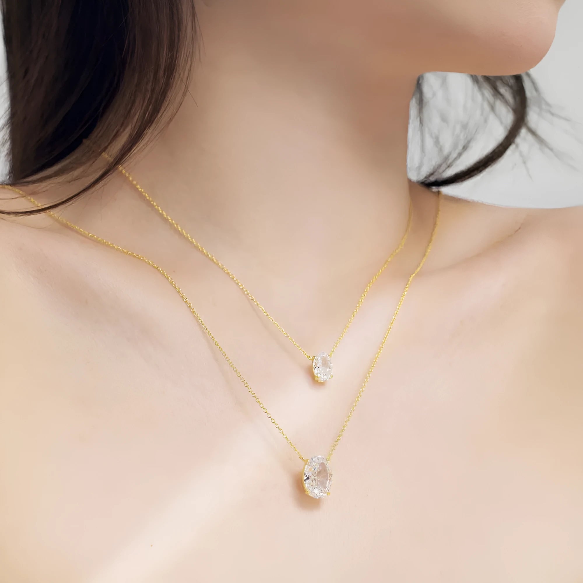 Sterling silver necklace with geometric oval ice flower pendant in platinum or gold finish