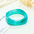 Resin arc bracelet in coffee colour with geometric blooming design and electroplating finish