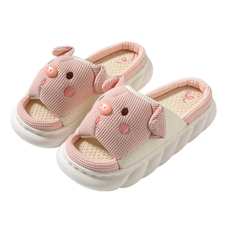 White linen open toe flip flop slippers for couples on a light background, showing PVC sole and strap detail.