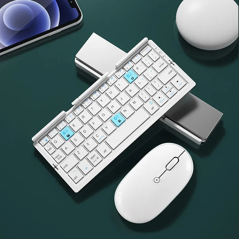 Aluminium folding Bluetooth keyboard open with phone on stand next to folded compact size