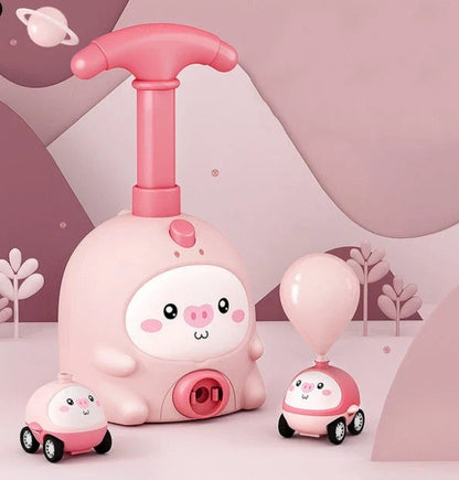 Colorful balloon-powered car toy with various animal designs, featuring a launch tower and balloons for children to propel the car using air power