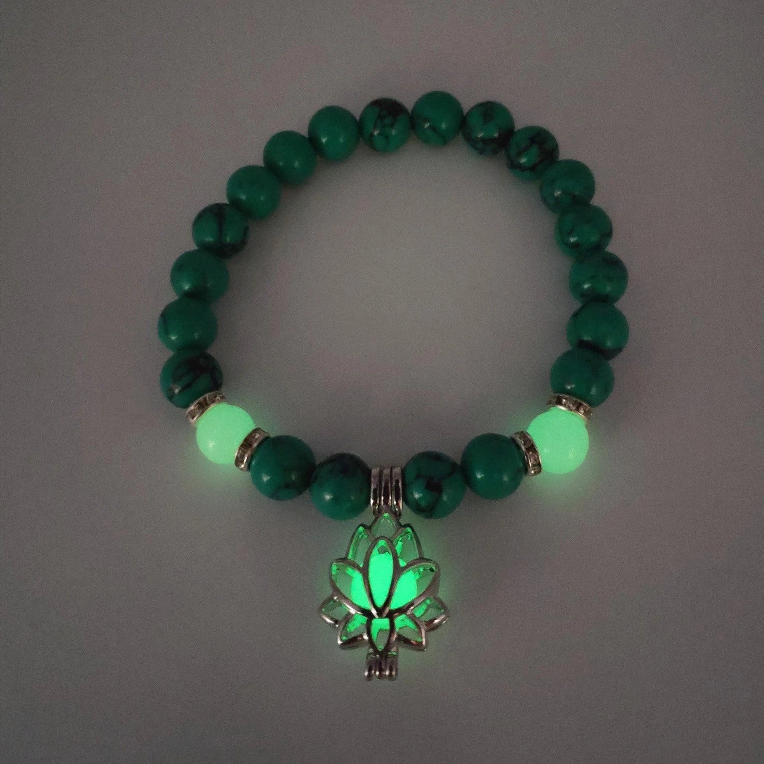 Luminous lotus charm bracelet with mesmerizing glow-in-the-dark beads, made of premium alloy and turquoise fluorescent stone