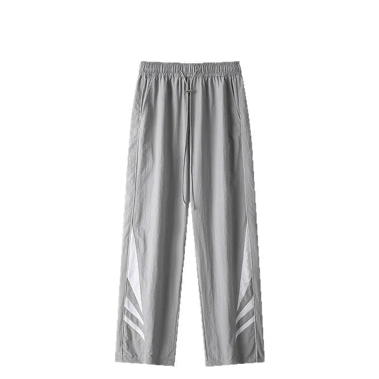 Men's straight-leg black casual sports trousers with a button fly and elastic mid-waist.