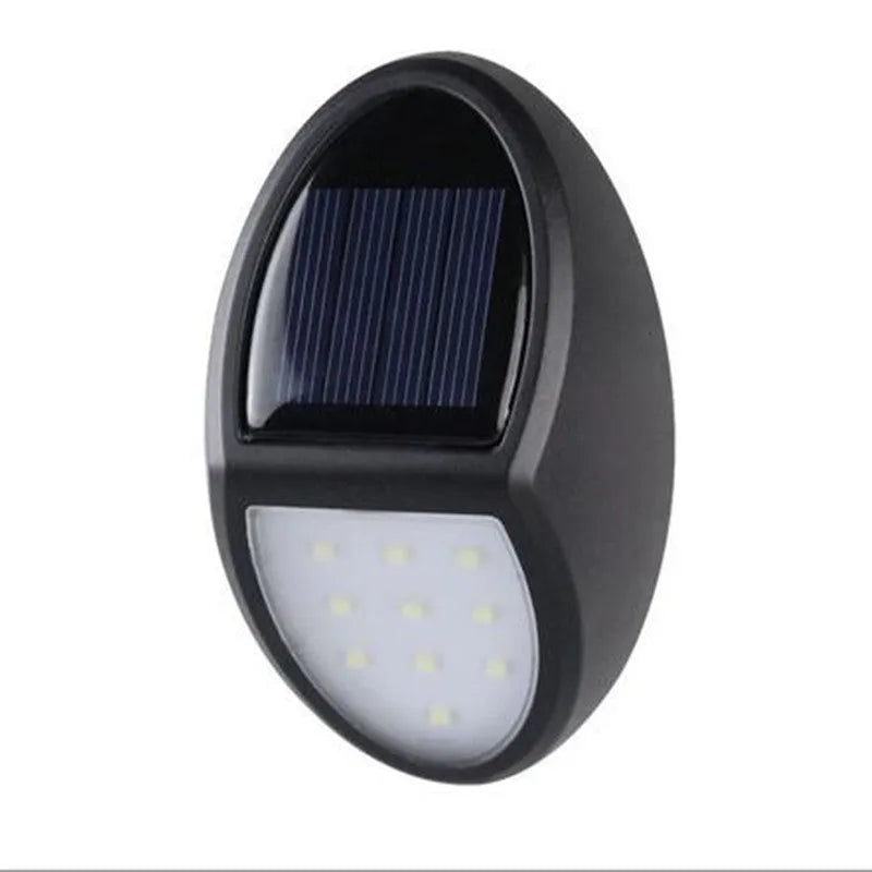 Black compact square solar-powered LED wall light for outdoor use.