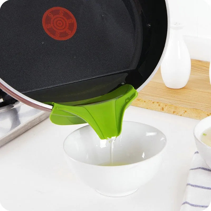 Green silicone clip-on kitchen funnel for pouring liquids into round pots.