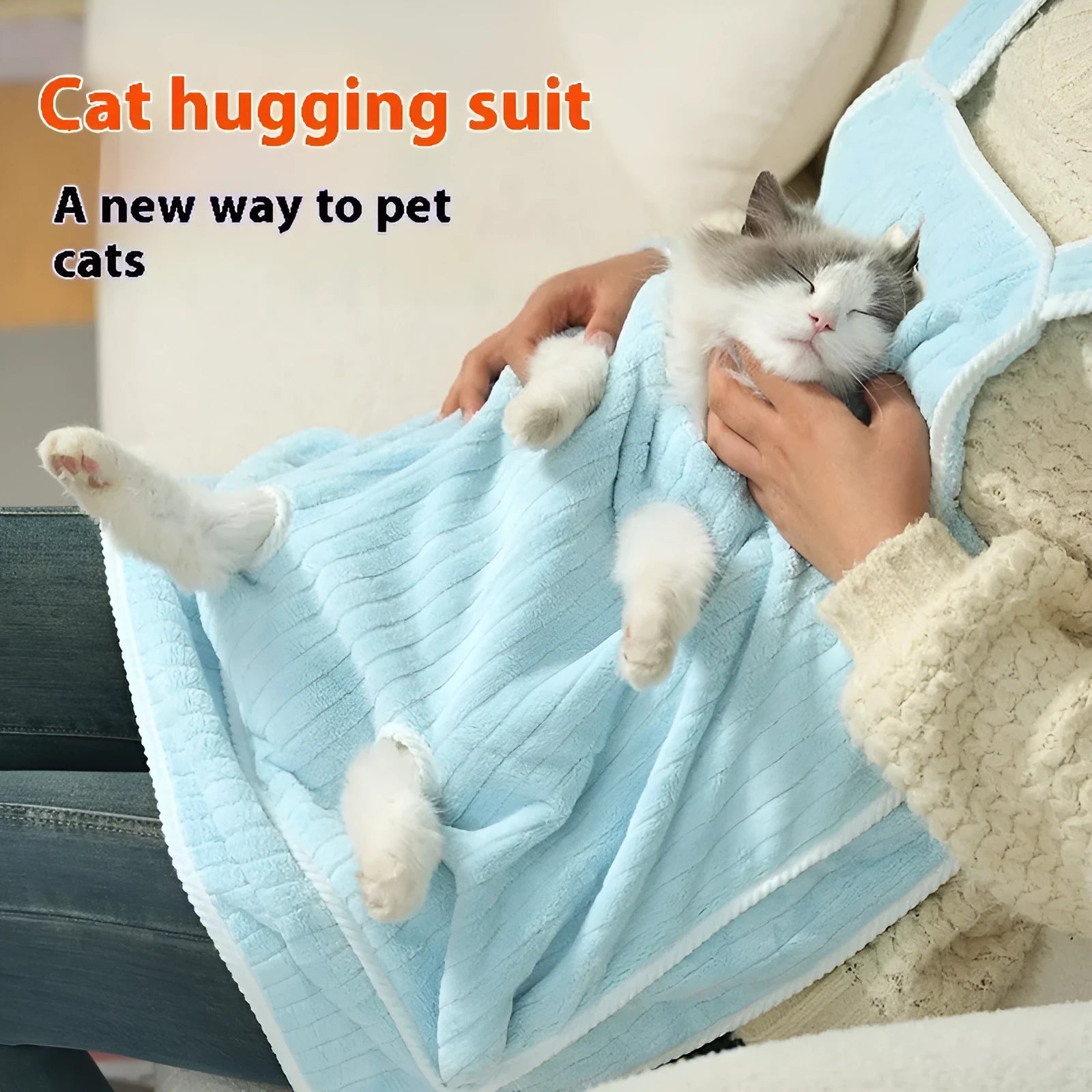 Cloth cat grooming apron worn by person holding a cat, shown in light blue colour with hole option.