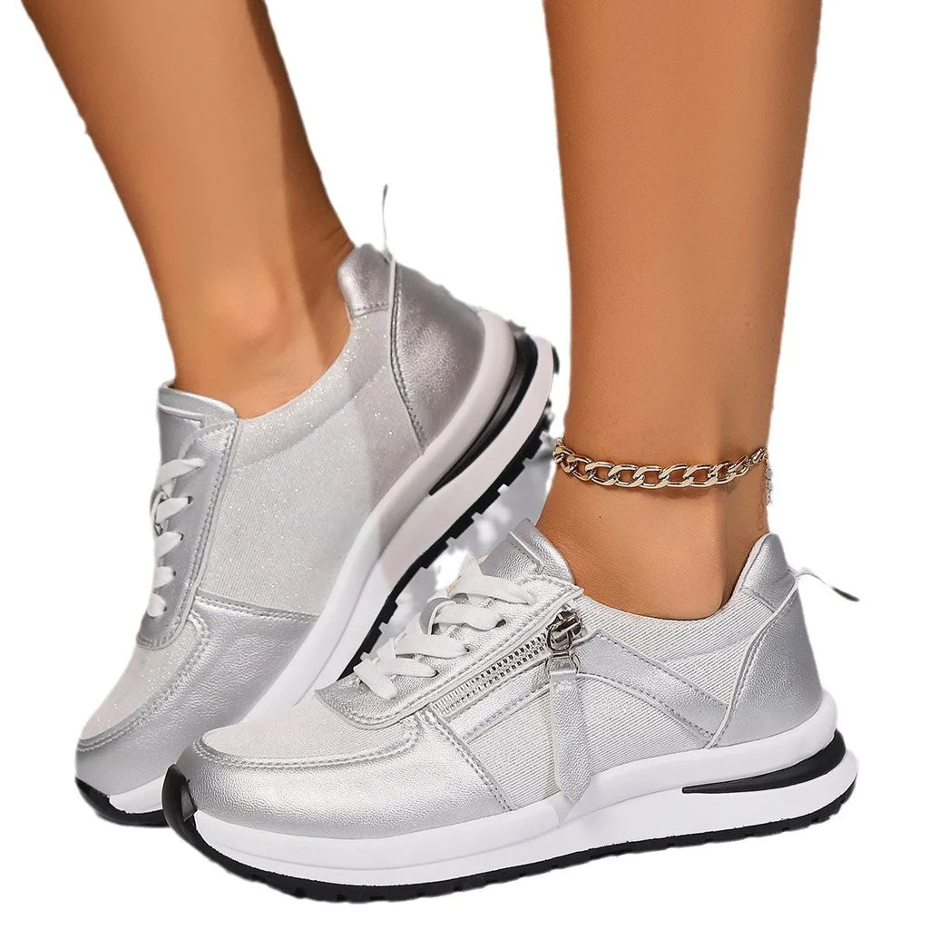 Gold women's flat lace-up pumps with round toe and shallow vamp on a rubber sole, showing European large size label.