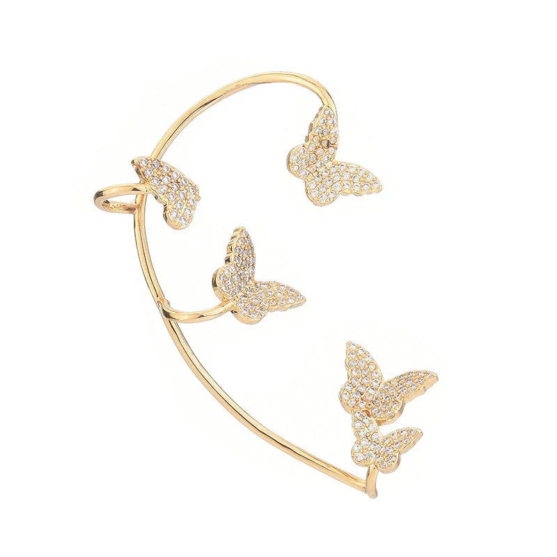 Sparkling zircon butterfly ear cuffs in gold-toned metal, featuring a delicate and elegant design for stylish accessorizing