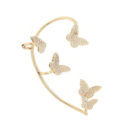 Sparkling zircon butterfly ear cuffs in gold-toned metal, featuring a delicate and elegant design for stylish accessorizing