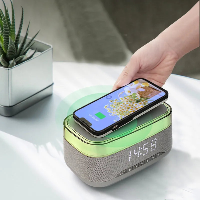 White multifunctional alarm clock with Bluetooth speaker, wireless charging pad, and ambient night light.