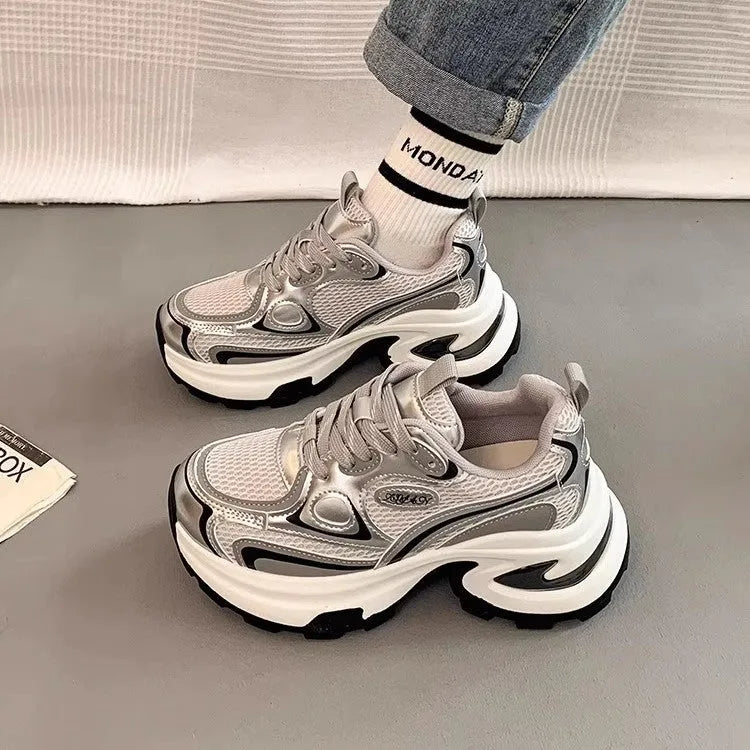 Women's red and silver mesh platform sneakers with flat heel and lace-up front.
