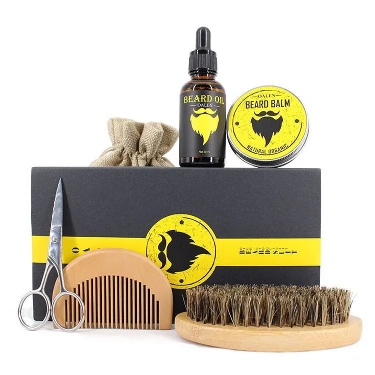 Beard Care Kit 6-piece set with beard cream, beard oil, peach wood comb, bristle brush, scissors, and linen bag on a wooden surface