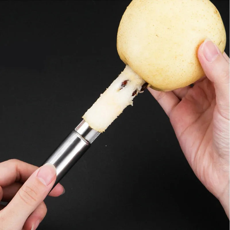 Stainless steel pineapple corer slicer with coloured ABS handle on kitchen counter