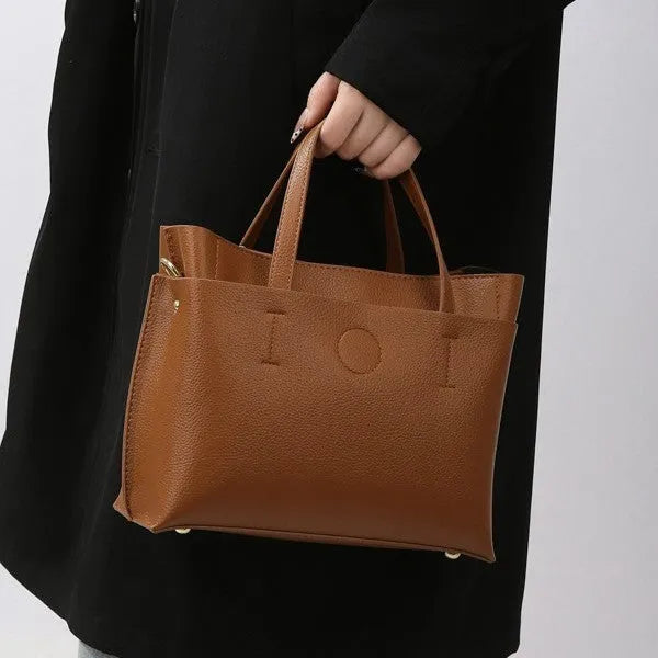 Large capacity multi-compartment soft surface PU tote bag in khaki with sewing thread details and single shoulder strap