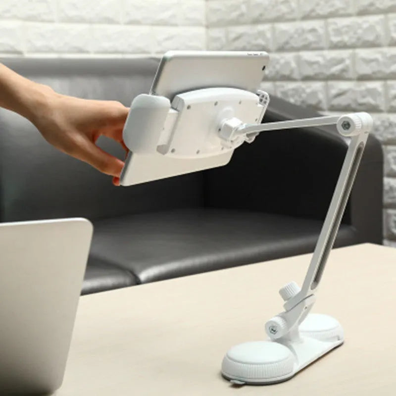 Aluminium alloy sucker bracket with double suction cup holding a mobile phone on a smooth table surface